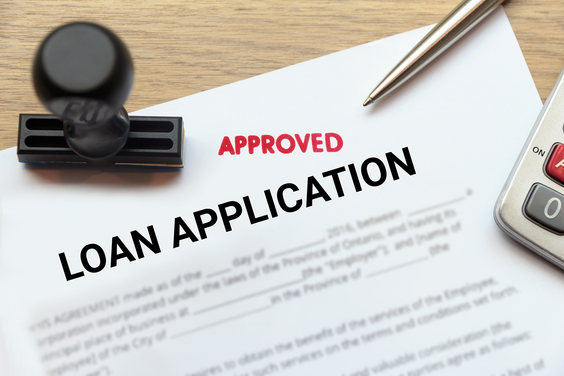 Approved loan application laying on a table